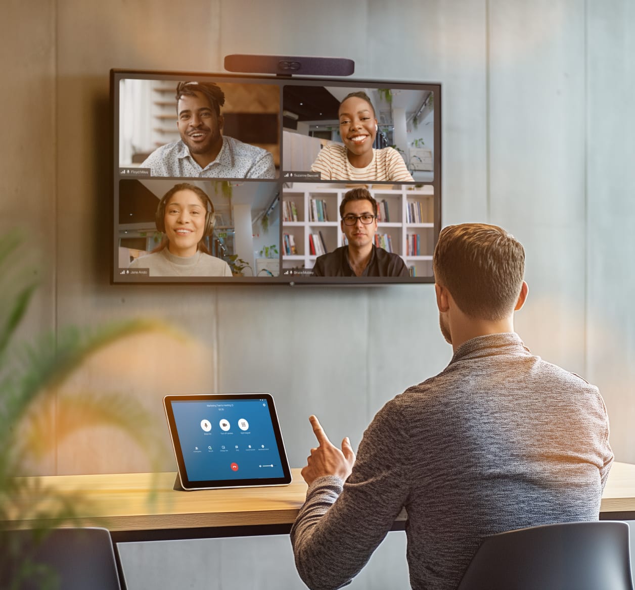 A man having attending a Video Conference using the RingCentral Rooms system