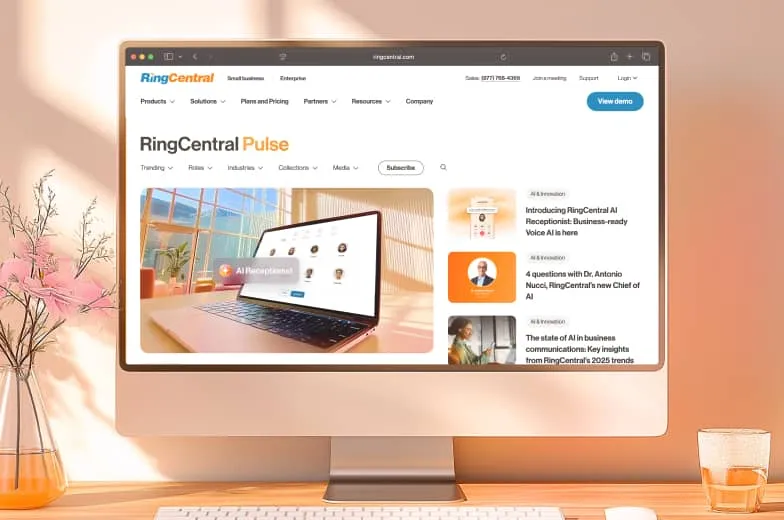 A RingCentral Pulse blog homepage displayed on a desktop monitor, featuring an article about RingCX's introduction of AI-powered workflows and enhanced analytics for effortless customer service operations.