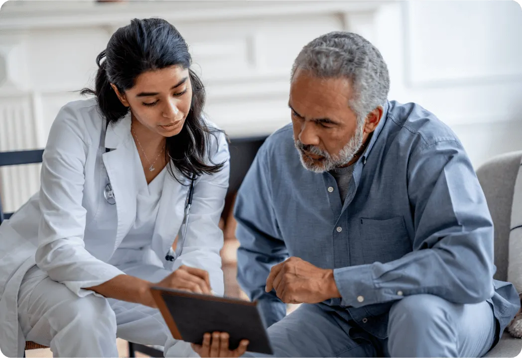 An eye doctor and patient review information on a tablet device
